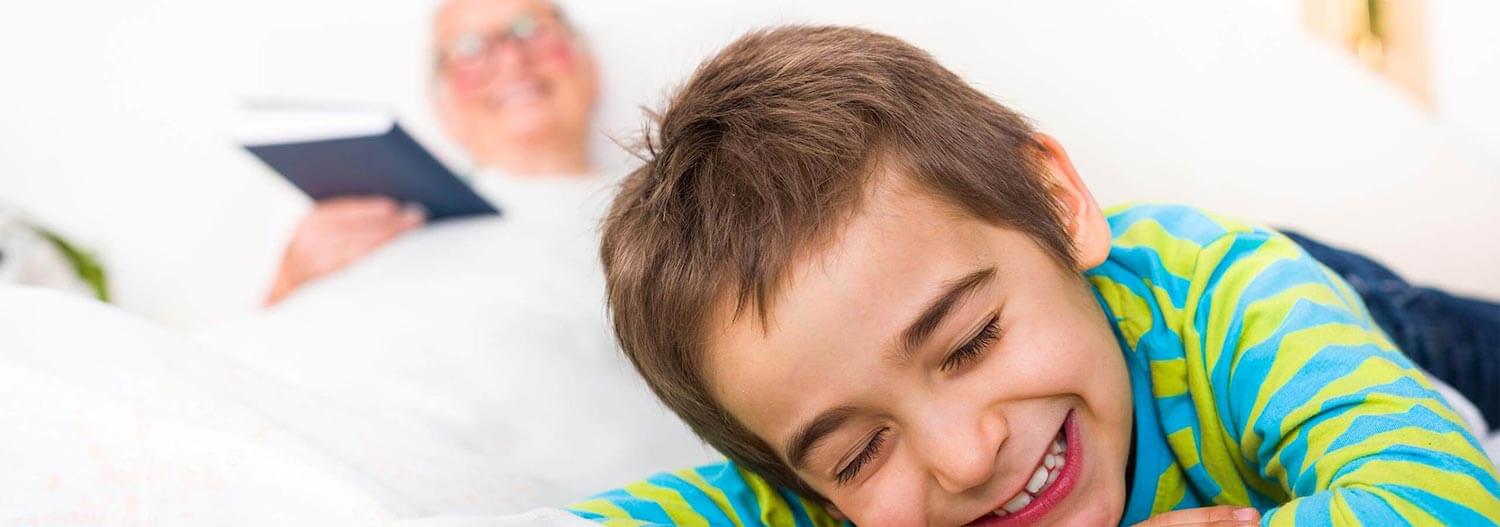 A grandmother and her grandson happy and laughing